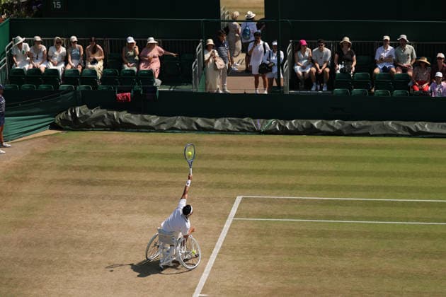 RECORD DATE NOT STATED 9th July 2026; All England Lawn Tennis and Croquet Club, London, England; Wimbledon Tennis Tournament, Day Eleven; Spectators watching Tokito Oda (JPN) serves toTakuya Miki (JPN) JohnxPatrickxFletcher