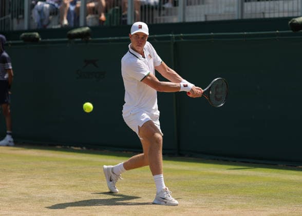 RECORD DATE NOT STATED 9th July 2026; All England Lawn Tennis and Croquet Club, London, England; Wimbledon Tennis Tournament, Day Eleven; Thijs Boogaard (NED) with a backhand shot to Oliver Page (GBR) JohnxPatrickxFletcher