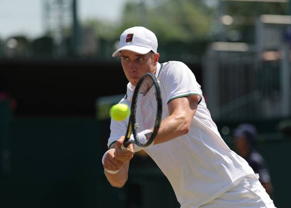 RECORD DATE NOT STATED 9th July 2026; All England Lawn Tennis and Croquet Club, London, England; Wimbledon Tennis Tournament, Day Eleven; Thijs Boogaard (NED) with a backhand shot to Oliver Page (GBR) JohnxPatrickxFletcher