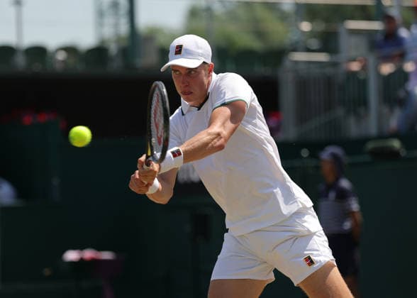 RECORD DATE NOT STATED 9th July 2026; All England Lawn Tennis and Croquet Club, London, England; Wimbledon Tennis Tournament, Day Eleven; Thijs Boogaard (NED) with a backhand shot to Oliver Page (GBR) JohnxPatrickxFletcher