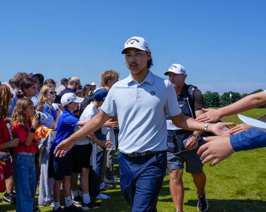 NORTH BERWICK, SCOTLAND - JULY 9: Min Woo Lee greets the fans after Round 1 of the Genesis Scottish Open at the Renaissance Club, North Berwick on July 9, 2026 in North Berwick, Scotland Genesis Scottish Open Round 1
