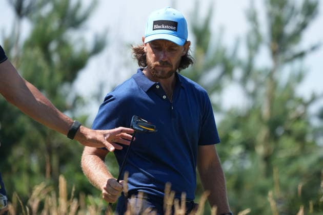 9th July 2026; The Renaissance Club, North Berwick, East Lothian, Scotland: Genesis Scottish Open Golf, Day One; Tommy Fleetwood gives his club to his caddie, Ian Finnis, as he walks to the fairway on the 1st hole AlecxBrown