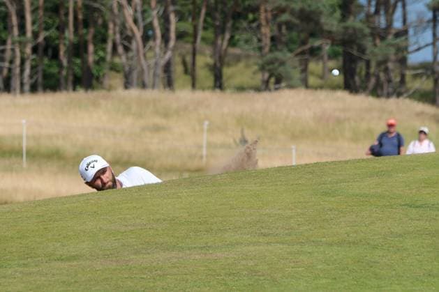 UK: The Genesis Scottish Open at The Renaissance Club, North Berwick, Scotland on 09 July 2026: Pictured: Jon Rahm (Spain) hits out of a bunker on the 8th green during the first round of the Genesis Scottish Open Championship 2026 North Berwick The Renaissance Club Scotland Scotland Copyright: xAlexxToddx
