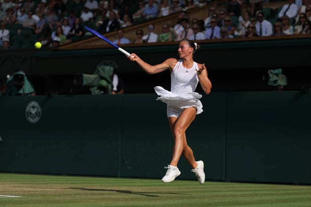 RECORD DATE NOT STATED 9th July 2026; All England Lawn Tennis and Croquet Club, London, England; Wimbledon Tennis Tournament, Day Eleven; Marta Kostyuk (UKR) with a forehand shot to Linda Noskova (CZE) JohnxPatrickxFletcher