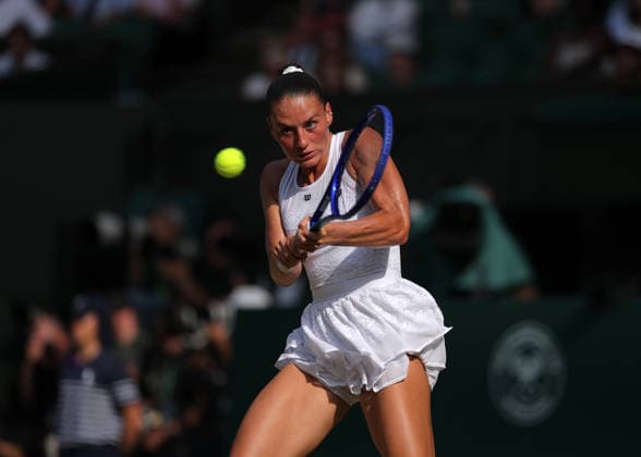 RECORD DATE NOT STATED 9th July 2026; All England Lawn Tennis and Croquet Club, London, England; Wimbledon Tennis Tournament, Day Eleven; Marta Kostyuk (UKR) with a backhand shot to Linda Noskova (CZE) JohnxPatrickxFletcher