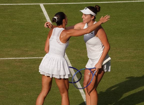Tennis - 2026 Wimbledon Championships - Day Eleven (Week Two) - All England Lawn Tennis & Croquet Club, London - Thursday 8th July 2026 Centre Court : Ladies Singles Semi Final : Marta Kostyuk (UKR) v Linda Noskova (CZE) Linda Noskova (CZE) with Marta Kostyuk after the match COLORSPORT ANDREW COWIE 