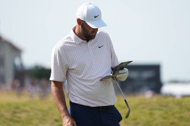 9th July 2026; The Renaissance Club, North Berwick, East Lothian, Scotland: Genesis Scottish Open Golf, Day One; Scottie Scheffler studies his yardage book before hitting his approach shot into the green at the 10th hole AlecxBrown