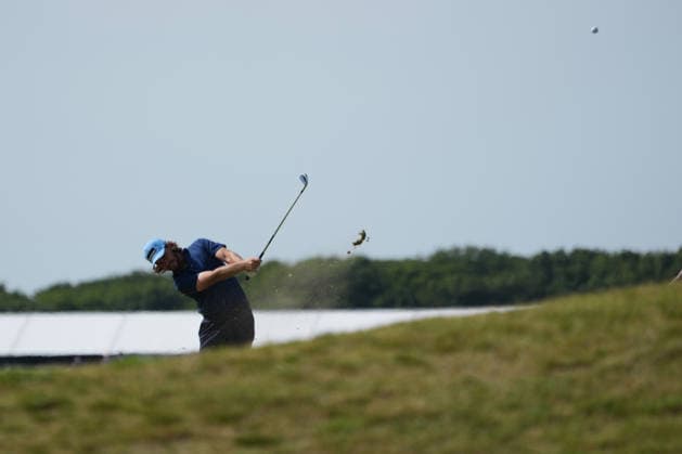 9th July 2026; The Renaissance Club, North Berwick, East Lothian, Scotland: Genesis Scottish Open Golf, Day One; Tommy Fleetwood hits his approach shot into the green on the 10th hole AlecxBrown