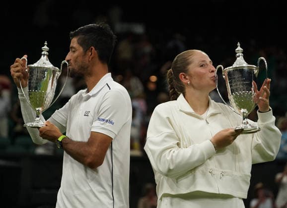 Tennis - 2026 Wimbledon Championships - Day Eleven (Week Two) - All England Lawn Tennis & Croquet Club, London - Thursday 8th July 2026 Centre Court : Mixed Doubles Final : Marc Polmans and Storm Hunter (AUS) v Marcelo Arevalo (ESA) and Jelena Ostapenko (LAT) Marcelo Arevalo (ESA) and Jelena Ostapenko (LAT) COLORSPORT ANDREW COWIE 