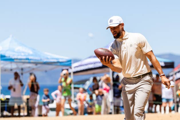STATELINE, NV - JULY 09: Stephen Curry catches a football on the 17th hole during the preview round of the American Century Championship on July 9, 2026 at Edgewood Tahoe Golf Course in Stateline, NV. (Photo by Matthew Huang Icon Sportswire) GOLF: JUL 09 American Century Championship EDITORIAL USE ONLY Icon260709061