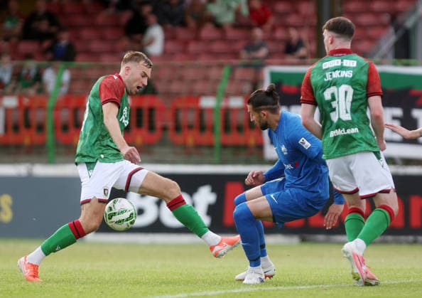 UEFA Europa Conference League First Qualifying Round First Leg, The Oval, Belfast 9 7 2026 Glentoran vs RFS Glentoran™s Daniel Larmour with RFS™s Herdi Prenga Daniel Larmour with Herdi Prenga 9 7 2026  Copyright: xx 090726JP3football025
