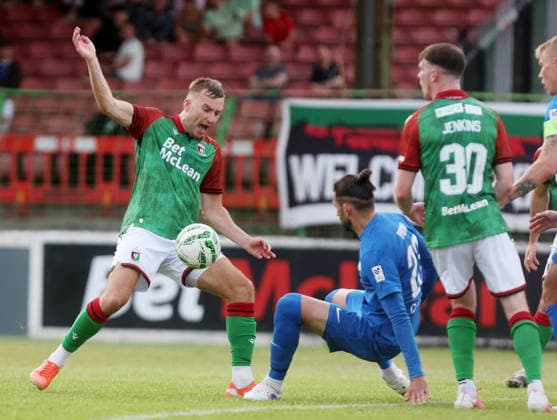 UEFA Europa Conference League First Qualifying Round First Leg, The Oval, Belfast 9 7 2026 Glentoran vs RFS Glentoran™s Daniel Larmour with RFS™s Herdi Prenga Daniel Larmour with Herdi Prenga 9 7 2026  Copyright: xx 090726JP3football026
