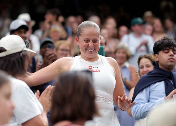 RECORD DATE NOT STATED 9th July 2026; All England Lawn Tennis and Croquet Club, London, England; Wimbledon Tennis Tournament, Day Eleven; Jelena Ostapenko (LAT) celebrates with her doubles partner Marcelo Arevalo (SLV) in the crowd after defeating Marc Polmans (AUS) and Storm Hunter (AUS) in the Mixed Doubles Semi Final JohnxPatrickxFletcher