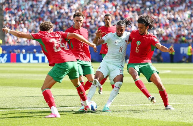 Michael Olise of France (11) is challenged by Morocco s Ayyoub Bouaddi (6) and Neil El Aynaoui (24) in the first half of a Quarter-final FIFA World Cup, WM, Weltmeisterschaft, Fussball match at Boston Stadium in Foxborough, Massachusetts, on Thursday, July 9, 2026.  BOS20260709806 CHRISTIANxBRUNSKILL