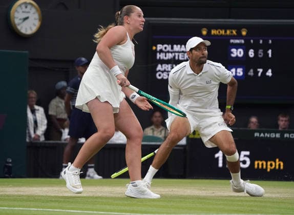 Tennis - 2026 Wimbledon Championships - Day Eleven (Week Two) - All England Lawn Tennis & Croquet Club, London - Thursday 8th July 2026 Centre Court : Mixed Doubles Final : Marc Polmans and Storm Hunter (AUS) v Marcelo Arevalo (ESA) and Jelena Ostapenko (LAT) Marcelo Arevalo (ESA) and Jelena Ostapenko (LAT) COLORSPORT ANDREW COWIE 