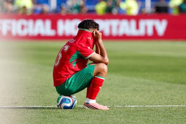 July 9, 2026; Foxborough, Massachusetts, USA; Morocco midfielder Gessime Yassine (16) sits in despair after a quarterfinal match of the FIFA World Cup, WM, Weltmeisterschaft, Fussball 2026 between France and Morocco at Boston Stadium. (c) CSM - ZUMAc04_ 20260709_zma_c04_058 Copyright: xBurtxGranofskyx