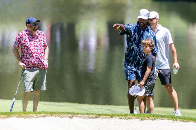 STATELINE, NV - JULY 09: Davante Adams interacts with a child on the sixth green during the preview round of the American Century Championship on July 9, 2026 at Edgewood Tahoe Golf Course in Stateline, NV. (Photo by Matthew Huang Icon Sportswire) GOLF: JUL 09 American Century Championship EDITORIAL USE ONLY Icon260709077