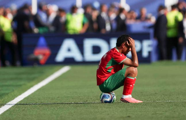 260710 -- BOSTON, July 10, 2026 -- Gessime Yassine of Morocco reacts after the quarter final match between France and Morocco at the 2026 FIFA World Cup, WM, Weltmeisterschaft, Fussball at Boston Stadium in Boston, the United States, July 9, 2026. SPU.S.-BOSTON-FOOTBALL-FIFA WORLD CUP-QUARTER FINAL-FRA VS MAR ZhangxChen  (SP)U.S.-BOSTON-FOOTBALL-FIFA WORLD CUP-QUARTER FINAL-FRA VS MAR IMAGO ZhangxChen  imago images 0861210667