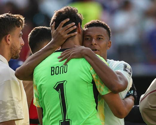 (260710) -- BOSTON, July 10, 2026 -- Kylian Mbappe (R) of France hugs Yassine Bounou, goalkeeper of Morocco after the quarter final match between France and Morocco at the 2026 FIFA World Cup, WM, Weltmeisterschaft, Fussball at Boston Stadium in Boston, the United States, July 9, 2026. ) (SP)U.S.-BOSTON-FOOTBALL-FIFA WORLD CUP-QUARTER FINAL-FRA VS MAR HuxXingyu 