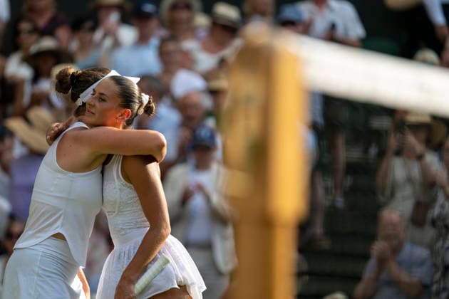 (260710) -- LONDON, July 10, 2026 -- Linda Noskova of the Czech Republic and Marta Kostyuk of Ukraine hug after their women s semifinal match at the Wimbledon Tennis Championships in London, Britain, on July 9, 2026. (Photo by Xinhua) (SP)BRITAIN-LONDON-TENNIS-WIMBLEDON-WOMEN S SINGLES StephenxChung 