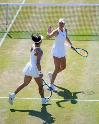 (260710) -- LONDON, July 10, 2026 -- Guo Hanyu Kristina Mladenovic(R) react during the women s doubles quarterfinal match between Katerina Siniakova (the Czech Republic) Taylor Townsend (the United States of America) and Guo Hanyu (China) Kristina Mladenovic (France) at the Wimbledon Tennis Championships in London, Britain, on July 9, 2026. (Photo by Xinhua) (SP)BRITAIN-LONDON-TENNIS-WIMBLEDON-WOMEN S DOUBLES StephenxChung 