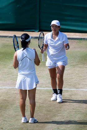 (260710) -- LONDON, July 10, 2026 -- Jiang Xinyu (R) Xu Yifan celebrate after winning the women s doubles quarterfinal match between Ingrid Neel (Estonia) Giuliana Olmos (Mexico) and Jiang Xinyu Xu Yifan of China at the Wimbledon Tennis Championships in London, Britain, on July 9, 2026. (Photo by Xinhua) (SP)BRITAIN-LONDON-TENNIS-WIMBLEDON-WOMEN S DOUBLES StephenxChung 