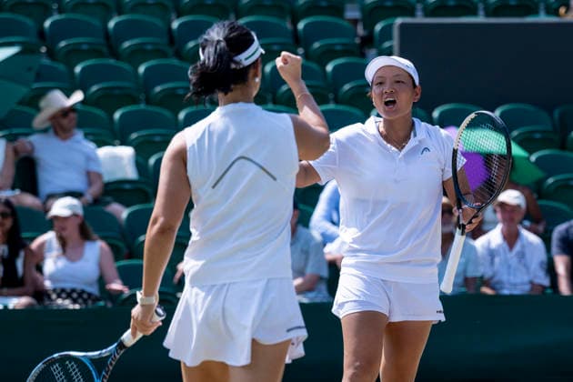 (260710) -- LONDON, July 10, 2026 -- Jiang Xinyu (R) Xu Yifan react during the women s doubles quarterfinal match between Ingrid Neel (Estonia) Giuliana Olmos (Mexico) and Jiang Xinyu Xu Yifan of China at the Wimbledon Tennis Championships in London, Britain, on July 9, 2026. (Photo by Xinhua) (SP)BRITAIN-LONDON-TENNIS-WIMBLEDON-WOMEN S DOUBLES StephenxChung 