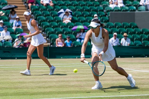 (260710) -- LONDON, July 10, 2026 -- Guo Hanyu (R) Kristina Mladenovic compete during the women s doubles quarterfinal match between Katerina Siniakova (the Czech Republic) Taylor Townsend (the United States of America) and Guo Hanyu (China) Kristina Mladenovic (France) at the Wimbledon Tennis Championships in London, Britain, on July 9, 2026. (Photo by Xinhua) (SP)BRITAIN-LONDON-TENNIS-WIMBLEDON-WOMEN S DOUBLES StephenxChung 