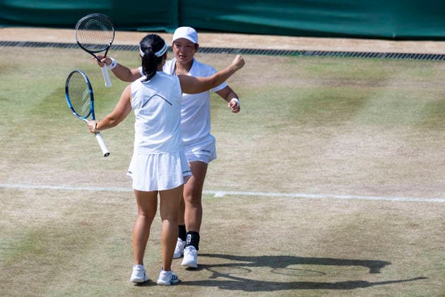 (260710) -- LONDON, July 10, 2026 -- Jiang Xinyu (R) Xu Yifan celebrate after winning the women s doubles quarterfinal match between Ingrid Neel (Estonia) Giuliana Olmos (Mexico) and Jiang Xinyu Xu Yifan of China at the Wimbledon Tennis Championships in London, Britain, on July 9, 2026. (Photo by Xinhua) (SP)BRITAIN-LONDON-TENNIS-WIMBLEDON-WOMEN S DOUBLES StephenxChung 