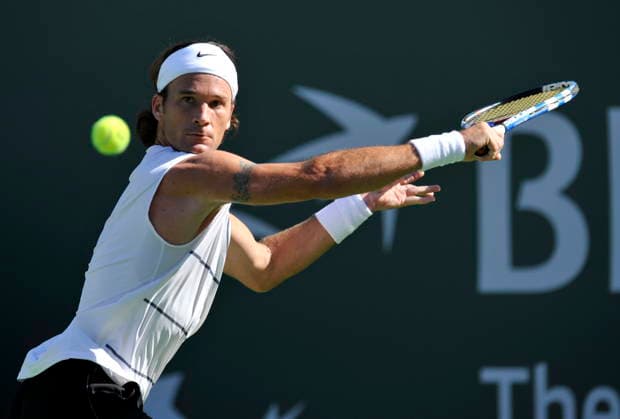 USA TENNIS BNP PARIBAS OPEN Carlos Moya epa02075761 Carlos Moya of Spain sets-up for a backhand slice against Tim Smyczek of the USA at the BNP Paribas Open tennis tournament in Indian Wells, California, USA, 11 March 2010. INDIAN WELLS United States  Copyright: xJOHNxG.xMABANGLOx