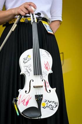 A guitar signed by cyclists and General Director of the Tour de France Christian Prudhomme pictured at the start of stage 7 of the 2026 Tour de France cycling race, a stage of 175km from Hagetmau to Bordeaux, on Friday 10 July 2026. The 113th edition of the Tour de France starts on Saturday 4 July in Barcelona, Spain, and will finish in Paris, France on the 26th of July. DAVIDxPINTENS  x180847712x