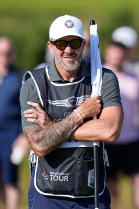 NORTH BERWICK, SCOTLAND - JULY 10: Ian Finnis caddie to Tommy Fleetwood waits on the 10th green during Round 2 of the Genesis Scottish Open at the Renaissance Club, North Berwick on July 10, 2026 in North Berwick, Scotland Genesis Scottish Open Round 2
