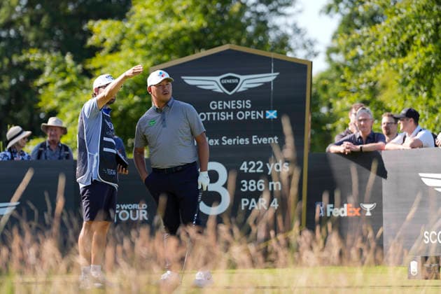 NORTH BERWICK, SCOTLAND - JULY 10: Si Woo Kim gets direction from his caddie on the 13th tee during Round 2 of the Genesis Scottish Open at the Renaissance Club, North Berwick on July 10, 2026 in North Berwick, Scotland Genesis Scottish Open Round 2