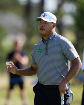 NORTH BERWICK, SCOTLAND - JULY 10: Si Woo Kim reacts after holing a putt on the 13th green during Round 2 of the Genesis Scottish Open at the Renaissance Club, North Berwick on July 10, 2026 in North Berwick, Scotland Genesis Scottish Open Round 2