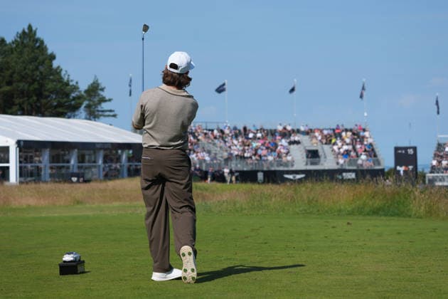 RECORD DATE NOT STATED 10th July 2026; The Renaissance Club, North Berwick, East Lothian, Scotland: Genesis Scottish Open Golf, Day Two; Tommy Fleetwood watches his tee shot on the par 3 15th hole during the second round AlecxBrown