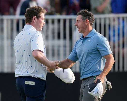 NORTH BERWICK, SCOTLAND - JULY 10: Rory McIlroy shakes hands with Robert MacIntyre after Round 2 of the Genesis Scottish Open at the Renaissance Club, North Berwick on July 10, 2026 in North Berwick, Scotland Genesis Scottish Open Round 2