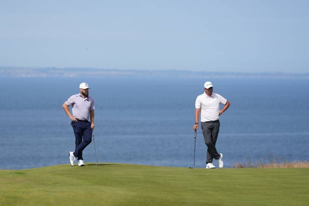RECORD DATE NOT STATED 10th July 2026; The Renaissance Club, North Berwick, East Lothian, Scotland: Genesis Scottish Open Golf, Day Two; Tyrrell Hatton and Victor Hovland wait to putt under the sunshine during the second round of the Genesis Scottish Open AlecxBrown