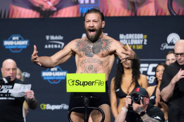 July 10, 2026, Las Vegas, Nevada, USA: CONOR MCGREGOR weighed 170.5 lbs and MAX HOLLOWAY weighed 170 lbs during ceremonial weigh-in at the T-Mobile Arena in Las Vegas. UFC 329: Conor McGregor And Max Holloway Intense Face Off  - ZUMAo117 20260710_zsp_o117_007 Copyright: xMikaelxOnax