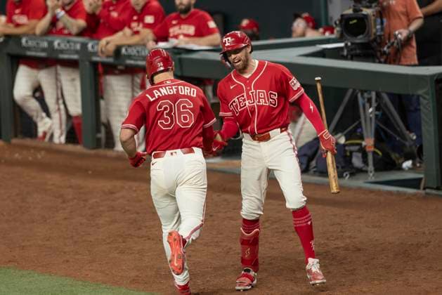 July 10, 2026, Arlington, Texas, USA: Texas Rangers right fielder BRANDON NIMMO (24) congratulates Texas Rangers left fielder WYATT LANGFORD (36) on a homerun during a MLB, Baseball Herren, USA game between the Houston Astros and Texas Rangers at Globe Life Field. Rangers win 7-3. Arlington USA - ZUMAf180 20260710_zsp_f180_001 Copyright: xMarkxFannx