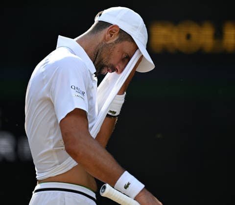 (260711) -- LONDON, July 11, 2026 -- Novak Djokovic reacts during the men s singles semifinal between Jannik Sinner of Italy and Novak Djokovic of Serbia at the Wimbledon Tennis Championships in London, Britain, on July 10, 2026. ) (SP)BRITAIN-LONDON-TENNIS-WIMBLEDON-MEN S SINGLES LixYing 