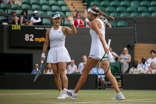 (260711) -- LONDON, July 11, 2026 -- Guo Hanyu (L) Kristina Mladenovic react during the women s doubles semi-finals match between Guo Hanyu (China) Kristina Mladenovic (France) and Jiang Xinyu Xu Yifan of China at the Wimbledon Tennis Championships in London, Britain, on July 10, 2026. (Photo by Xinhua) (SP)BRITAIN-LONDON-TENNIS-WIMBLEDON-WOMEN S DOUBLES StephenxChung 