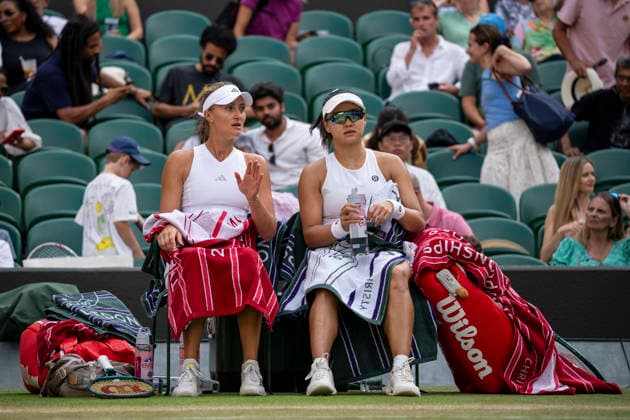 (260711) -- LONDON, July 11, 2026 -- Guo Hanyu (R) Kristina Mladenovic are seen during the women s doubles semi-finals match between Guo Hanyu (China) Kristina Mladenovic (France) and Jiang Xinyu Xu Yifan of China at the Wimbledon Tennis Championships in London, Britain, on July 10, 2026. (Photo by Xinhua) (SP)BRITAIN-LONDON-TENNIS-WIMBLEDON-WOMEN S DOUBLES StephenxChung 
