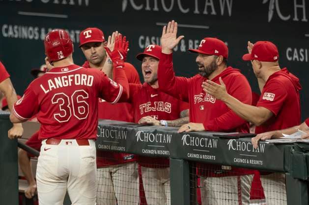 July 10, 2026, Arlington, Texas, USA: Texas Rangers bench reacts to the homerun from Texas Rangers left fielder WYATT LANGFORD (36) during a MLB, Baseball Herren, USA game between the Houston Astros and Texas Rangers at Globe Life Field. Rangers win 7-3. Arlington USA - ZUMAf180 20260710_zsp_f180_012 Copyright: xMarkxFannx