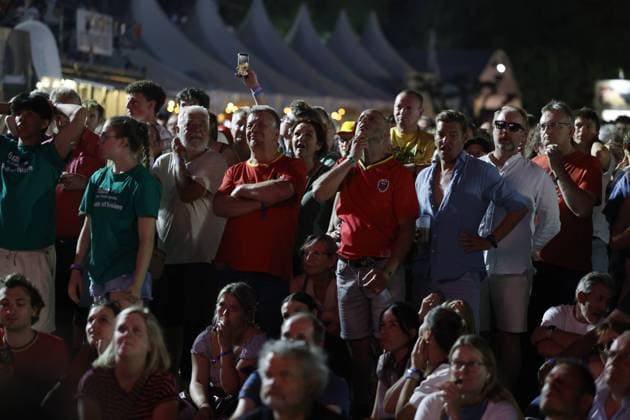 Fans look rejected when Spain scores the second goal during the screening of a soccer game between Belgian national soccer team Red Devils and Spain, at the Rock Zottegem music festival on Friday 10 July 2026 in Zottegem. The quarter final of the FIFA World Cup, WM, Weltmeisterschaft, Fussball WM, Weltmeisterschaft, Fussball 2026 is shown on a large screen. NICOLASxMAETERLINCK  x180905579x IMAGO NICOLASxMAETERLINCK  x1079524163stx