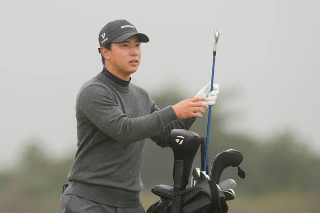 NORTH BERWICK, SCOTLAND - JULY 11: Yuto Katsuragawa selects his club on the first fairway during Round 3 of the Genesis Scottish Open at the Renaissance Club, North Berwick on July 11, 2026 in North Berwick, Scotland Genesis Scottish Open Round 3