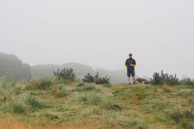 NORTH BERWICK, SCOTLAND - JULY 11: A marshall watches play on the 1st hole during Round 3 of the Genesis Scottish Open at the Renaissance Club, North Berwick on July 11, 2026 in North Berwick, Scotland Genesis Scottish Open Round 3