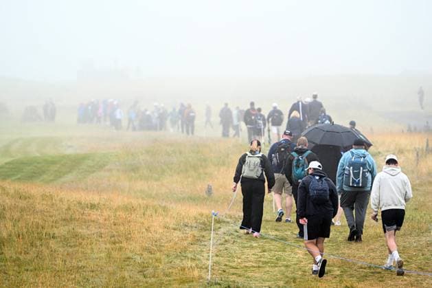 Scottish Open Day Three Fans walk in the rain and fog on Day Three of the Genesis Scottish Open 2026 at The Renaissance Club, North Berwick 11 07 2026 UK Newspapers OUT Copyright: xJamiexJohnstonx FIL-23616-0038