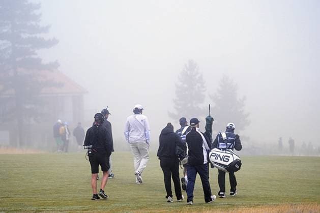 Scottish Open Day Three General view as Viktor Hovland and Eugenio Chacarra and their caddies walk in from hole 5 after play is halted for fog on Day Three of the Genesis Scottish Open 2026 at The Renaissance Club, North Berwick 11 07 2026 UK Newspapers OUT Copyright: xJamiexJohnstonx FIL-23616-0078