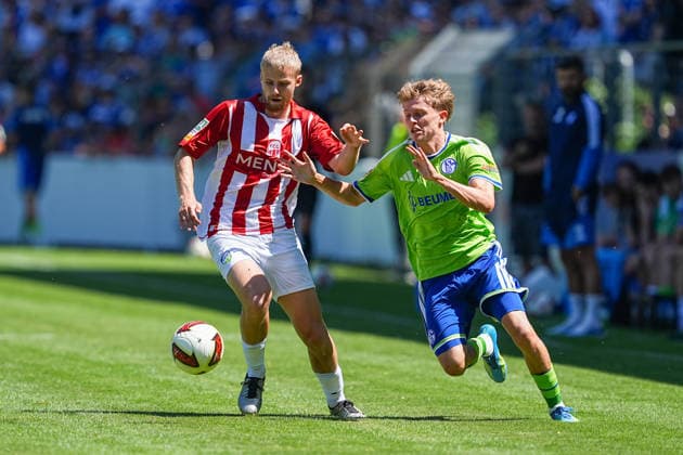 11.07.2026, xydrx, Fußball, Testspiel, FC Gütersloh - FC Schalke 04, Saison 2026 2027, Ohlendorf Stadion im Heidewald: Len Wilkesmann (FC Gütersloh, 15) im Zweikampf gegen Luca Vozar (FC Schalke 04, 38) DFB regulations prohibit any use of photographs as image sequences and or quasi-video. *** July 11, 2026, xydrx, soccer, friendly match, FC Gütersloh vs. FC Schalke 04, 2026–2027 season, Ohlendorf Stadium in Heidewald, Len Wilkesmann (FC Gütersloh), No. 15 in a tackle against Luca Vozar (FC Schalke 04), No. 38. DFB regulations prohibit any use of photographs as image sequences and or quasi-video. Copyright: HMBxMedia YannisxDreimann