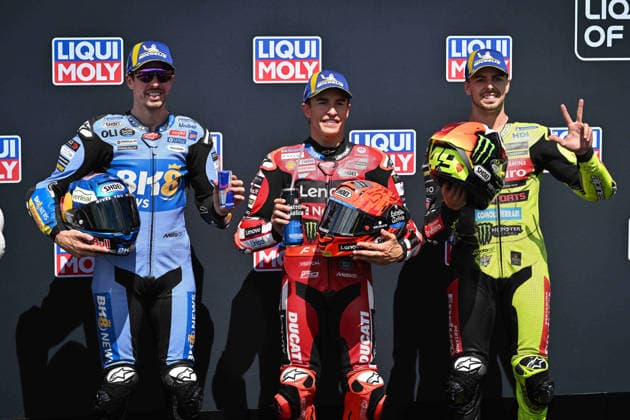 MOTO - MOTO GP - GERMANY GRAND PRIX 2026 MARQUEZ Marc (spa), Ducati Lenovo Team, Ducati Desmosedici GP26, portrait, celebrating his pole position with MARQUEZ Alex (spa), BK8 Gresini Racing MotoGP, Ducati Desmosedici GP26 and DI GIANNANTONIO Fabio (ita), Pertamina Enduro VR46 Racing Team, Ducati Desmosedici GP26 during the 2026 MotoGP Motul Liqui Moly Grand Prix of Germany, Germany GP, on the Sachsenring circuit, from July 10 to 12, in Germany - Hohenstein-ErnstthalGermany  Copyright: xGIGIxSOLDANOx